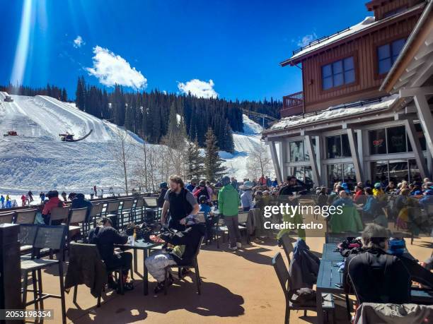 people enjoying sunny apres ski and dining outdoors. copper mountain, colorado. - after ski bildbanksfoton och bilder