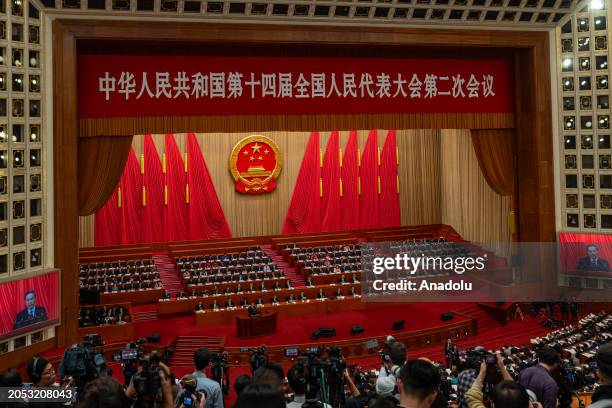 Chinese Premier Li Qiang delivers a speech during the opening of the Second Session of the 14th National People's Congress at the Great Hall of the...