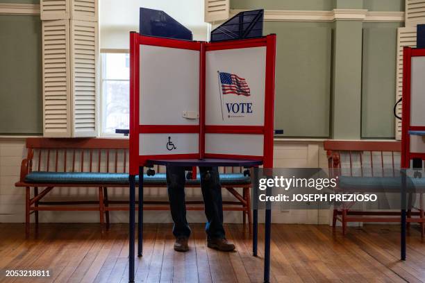 Person votes in the US Presidential Primary on Super Tuesday at the Town Hall Annex in Rockport, Massachusetts on March 5, 2024. Americans from 15...