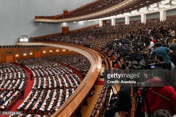 People attend the opening of the Second Session of the 14th National People's Congress at the Great Hall of the People in Beijing, China, on March 5,...