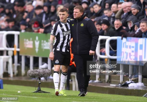 Kieran Trippier of Newcastle United leaves the field after picking up an injury and receiving medical treatment during the Premier League match...