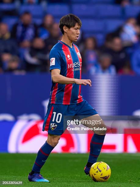 Kento Hashimoto of SD Huesca with the ball during the LaLiga Hypermotion match between RCD Espanyol and SD Huesca at Stage Front Stadium on March 02,...