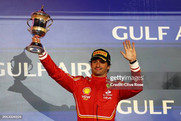 Third placed Carlos Sainz of Spain and Ferrari celebrates on the podium during the F1 Grand Prix of Bahrain at Bahrain International Circuit on March...