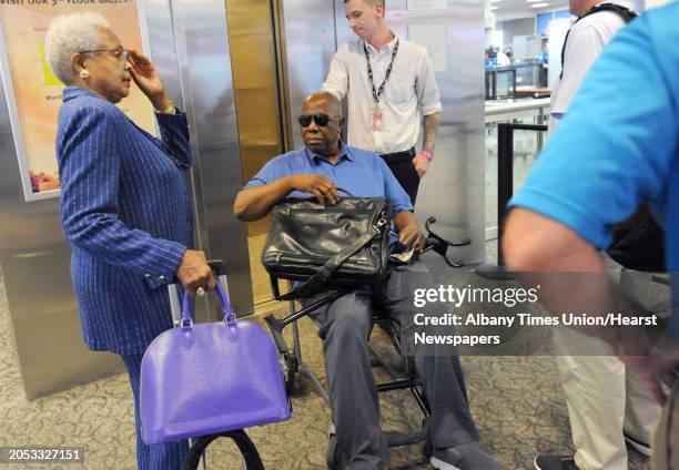 Baseball great Hank Aaron arrives at the Albany International Airport on his way to Cooperstown for the Hall of Fame weekend on Thursday, July 24,...