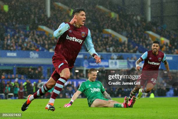 Edson Alvarez of West Ham United celebrates scoring his team's third goal as Jordan Pickford of Everton reacts during the Premier League match...