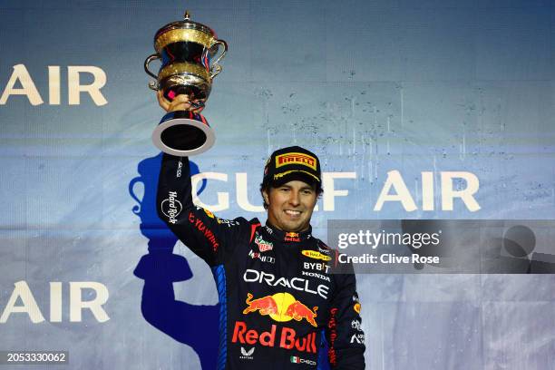 Second placed Sergio Perez of Mexico and Oracle Red Bull Racing celebrates on the podium during the F1 Grand Prix of Bahrain at Bahrain International...