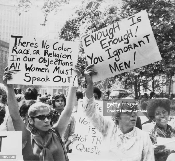 Women hold up signs demanding equal rights during a demonstration for women's liberation, New York City, circa 1968.