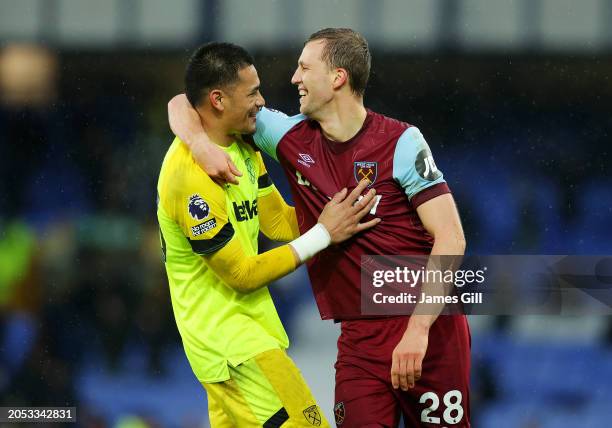 Alphonse Areola of West Ham United celebrates with teammate Tomas Soucek after defeating Everton during the Premier League match between Everton FC...