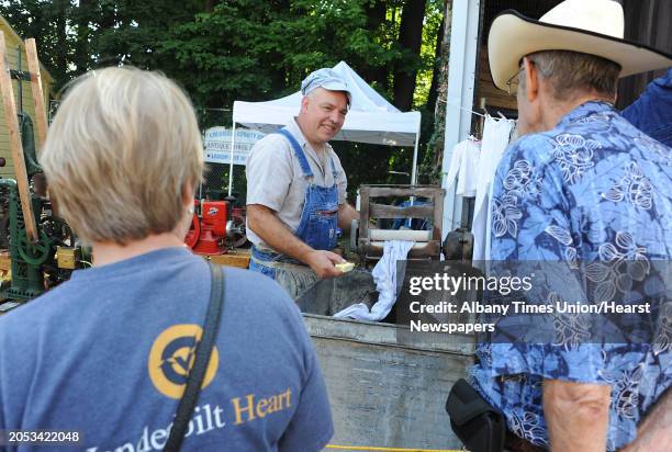 Dennis Gawron of East Chatham demonstrates how to wash clothes with an antique Thor washing machine at the Columbia County Fair on Monday, Sept. 7,...