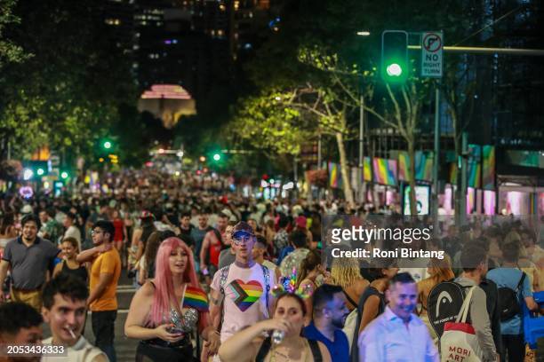 People walk along Oxford Street as they leave the parade after the Sydney Gay & Lesbian Mardi Gras Parade on March 02, 2024 in Sydney, Australia. The...