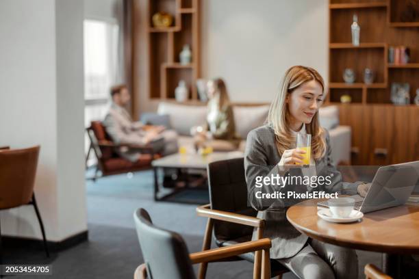 she's a master in the business world - business class lounge stock pictures, royalty-free photos & images