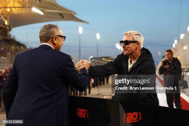 Stefano Domenicali, CEO of the Formula One Group, meets Diplo on the grid during the F1 Grand Prix of Bahrain at Bahrain International Circuit on...