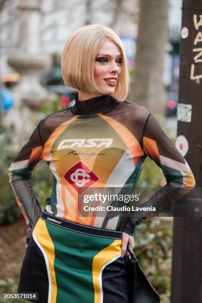 Coco Rocha wears printed Casablanca sheer turtleneck top, outside Casablanca, during the Womenswear Fall/Winter 2024/2025 as part of Paris Fashion...