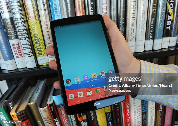 Library clerk Tim Furgal holds a borrowable tablet at the Albany Public Library on Tuesday, Nov. 24, 2015 in Albany, N.Y. The Samsung Galaxy Tab 2...