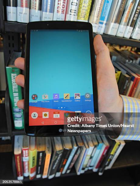 Library clerk Tim Furgal holds a borrowable tablet at the Albany Public Library on Tuesday, Nov. 24, 2015 in Albany, N.Y. The Samsung Galaxy Tab 2...