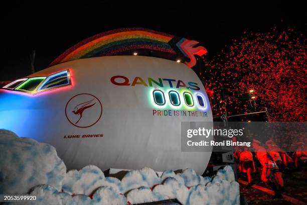 The Qantas float at Sydney�’s Mardi Gras Parade pays tribute to alleged murder victim Luke Davies, who was a flight attendant with the airline, by...