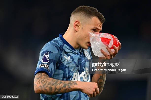 Lucas Digne of Aston Villa is seen with an ice bag after the team's victory in the Premier League match between Luton Town and Aston Villa at...