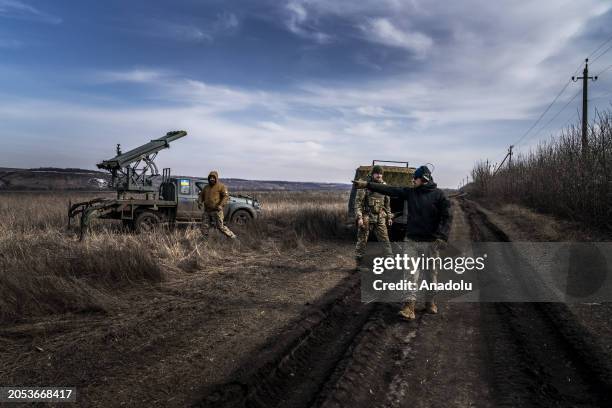 Ukrainian soldiers prepare to fire missiles from a Grad PC3B, with a homemade shuttle, at Russian positions in the direction of Bakhmut during the...
