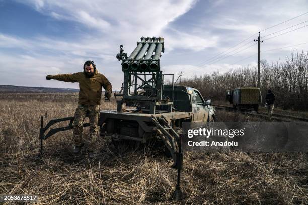 Ukrainian soldiers prepare to fire missiles from a Grad PC3B, with a homemade shuttle, at Russian positions in the direction of Bakhmut during the...