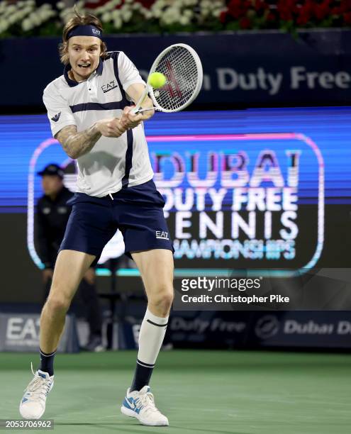 Alexander Bublik of Kazakhstan plays a backhand against Ugo Humbert of France in the final match during the Dubai Duty Free Tennis Championships at...