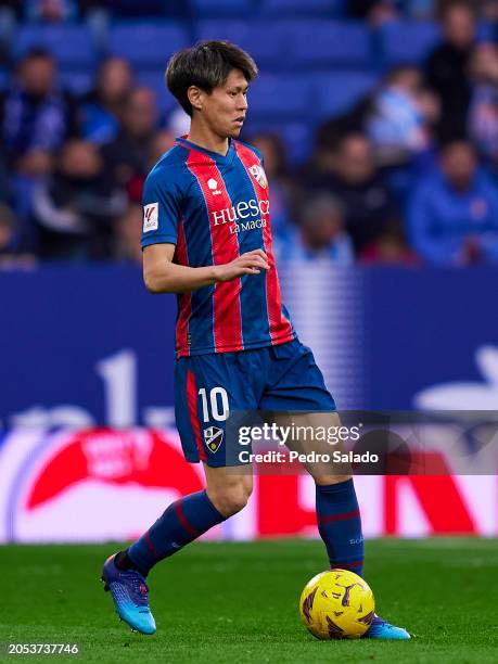 Kento Hashimoto of SD Huesca with the ball during the LaLiga Hypermotion match between RCD Espanyol and SD Huesca at Stage Front Stadium on March 02,...