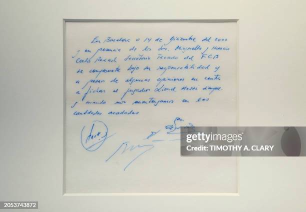 Napkin on which was written the first promise of a contract to secure 13-year-old Lionel Messi for FC Barcelona, is on display at Bonhams, New York,...