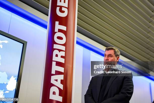 Bavarian Premier Markus Soeder looks at a Patriot Gem-T display while visiting a production facility of MBDA Deutschland on March 5, 2024 in...