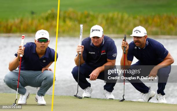 Min Woo Lee of Australia, Ryan Fox of New Zealand and Erik van Rooyen of South Africa lines up a putts on the 17th green during the third round of...