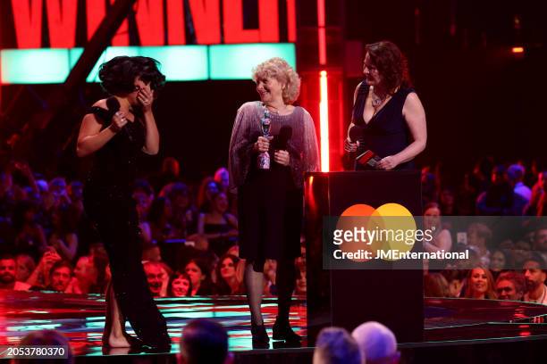 Jo Hamilton and Monica Dolan present the Song of the Year award to Raye for 'Escapism' during the BRIT Awards 2024 at The O2 Arena on March 02, 2024...