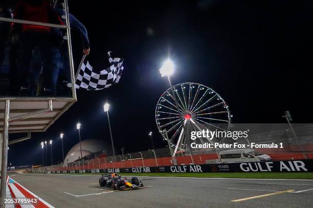 Race winner Max Verstappen of Netherlands driving the Oracle Red Bull Racing RB20 takes the chequered flag during the F1 Grand Prix of Bahrain at...