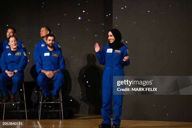 Nora Al Matrooshi waves during the graduation ceremony for NASA Artemis astronaut candidates at Johnson Space Center in Houston, Texas, on March 5,...