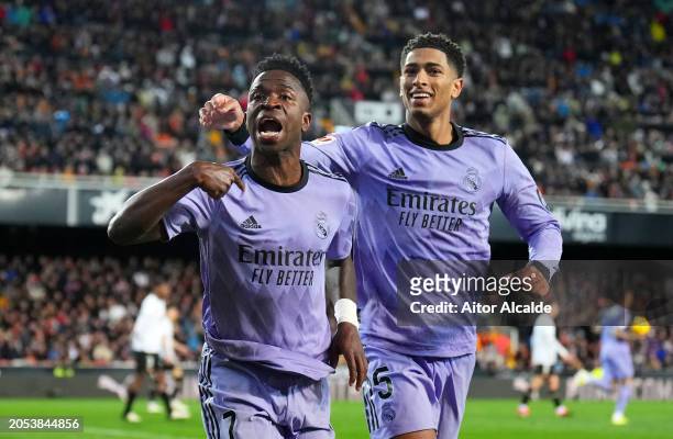 Vinicius Junior of Real Madrid celebrates scoring his team's second goal with teammate Jude Bellingham during the LaLiga EA Sports match between...