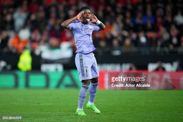 Vinicius Junior of Real Madrid celebrates scoring his team's second goal during the LaLiga EA Sports match between Valencia CF and Real Madrid CF at...