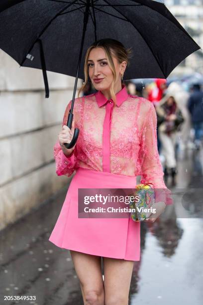 Audrey Peters wears pink transparent blouse, mini skirt, bag outside Ellie Saab during the Womenswear Fall/Winter 2024/2025 as part of Paris Fashion...