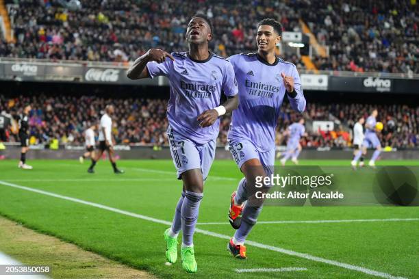 Vinicius Junior of Real Madrid celebrates scoring his team's second goal with teammate Jude Bellingham during the LaLiga EA Sports match between...