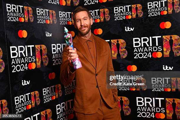 Calvin Harris poses with their Best Dance Act award in the winners room at the BRIT Awards 2024 at The O2 Arena on March 02, 2024 in London, England.