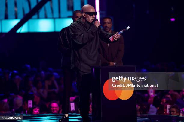 Kingsley Ben-Adir and Ashley Walters present the Hiphop/Grime/Rap Act award to Casisdead during the BRIT Awards 2024 at The O2 Arena on March 02,...