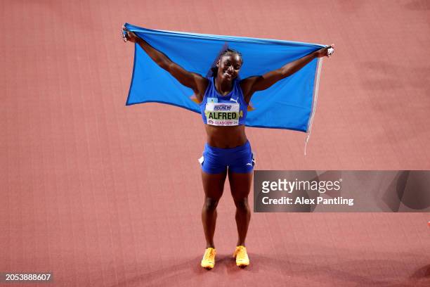 Gold medalist Julien Alfred of Team Saint Lucia poses for a photo after winning the Women's 60 Metres Final on Day Two of the World Athletics Indoor...