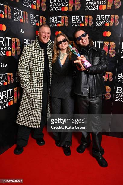 Josh Lloyd-Watson, Lydia Kitto and Tom McFarland of "Jungle" pose with their Group of the Year award in the winners room at the BRIT Awards 2024 at...