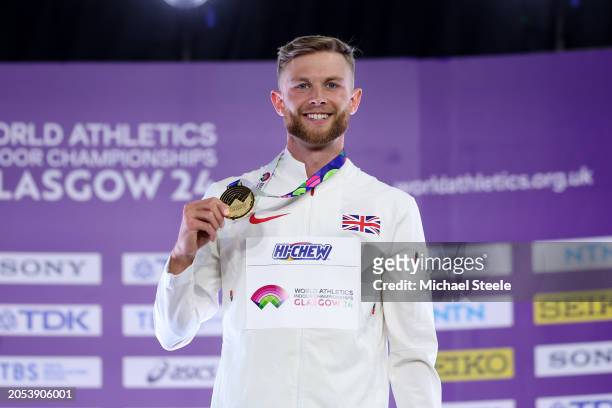 Gold medalist Josh Kerr of Team Great Britain poses for a photo during the medal ceremony for the Men's 3000 Metres Final on Day Two of the World...