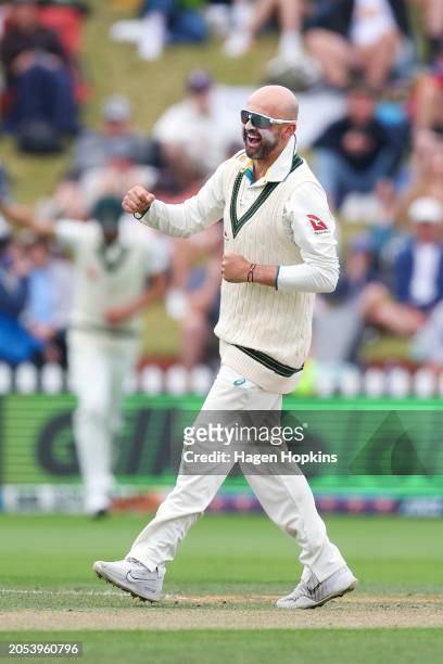 Nathan Lyon of Australia celebrates after taking the wicket of Glenn Phillips of New Zealand for a five wicket bag during day four of the First Test...