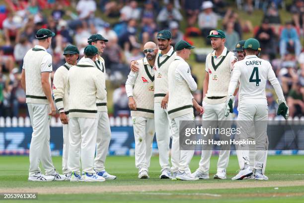 Nathan Lyon of Australia celebrates with staiafter taking the wicket of Glenn Phillips of New Zealand for a five wicket bag during day four of the...