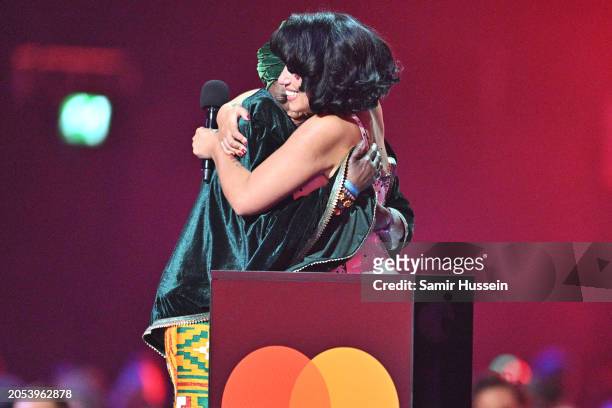 Raye crying on stage with her grandma after winning her fifth award of the evening for Album of the Year during the BRIT Awards 2024 at The O2 Arena...