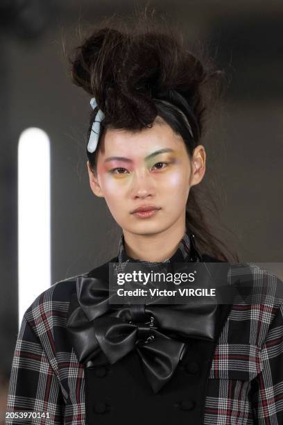 Model walks the runway during the Noir Kei Ninomiya Ready to Wear Fall/Winter 2024-2025 fashion show as part of the Paris Fashion Week on March 2,...