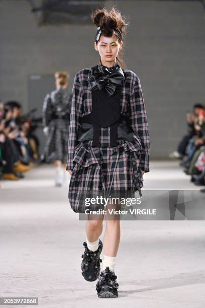 Model walks the runway during the Noir Kei Ninomiya Ready to Wear Fall/Winter 2024-2025 fashion show as part of the Paris Fashion Week on March 2,...