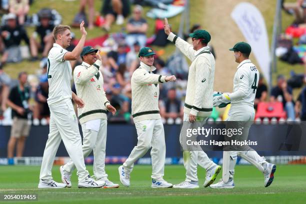 Cameron Green of Australia celebrates after taking the wicket of Scott Kuggeleijn of New Zealand during day four of the First Test in the series...