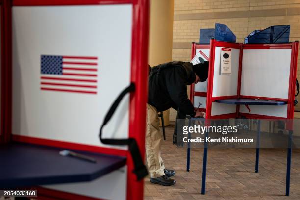 Voters cast their ballots at a polling location at the Bennett Park Apartments Art Atrium on March, 5 2024 in Arlington, Virginia. 15 States and one...