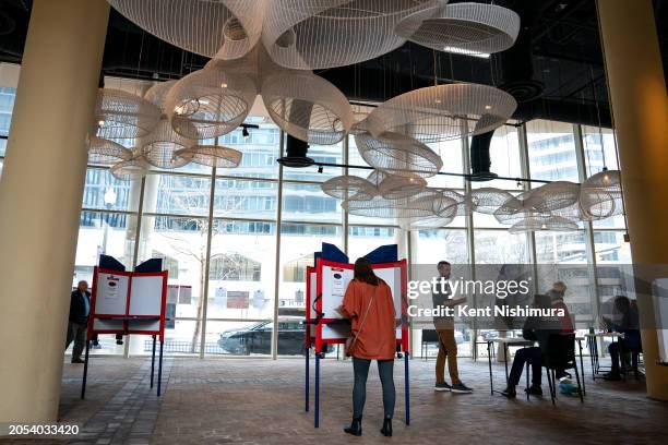 Voters cast their ballots at a polling location at the Bennett Park Apartments Art Atrium on March, 5 2024 in Arlington, Virginia. 15 States and one...