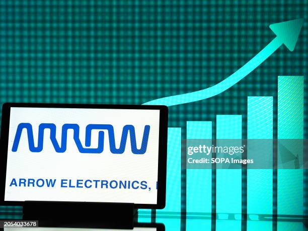 In this photo illustration, the Arrow Electronics logo seen displayed on a tablet.