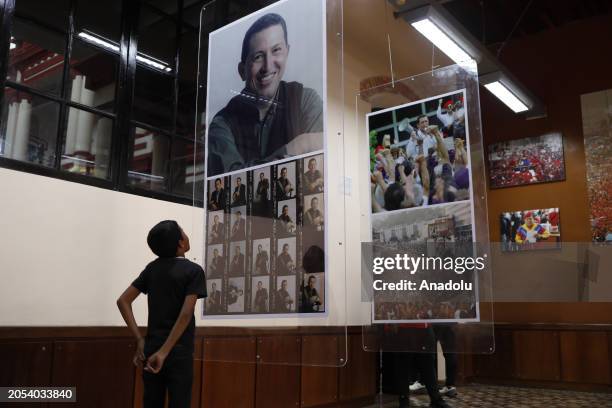 Visitors pay their respects at the tomb of the late Venezuelan President Hugo Chavez during commemorations of the 10th anniversary of his death,...